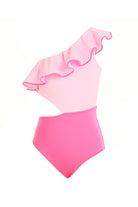 A soft pink one-piece swimsuit with a large ruffle on one shoulder and red piping detail, designed for children.